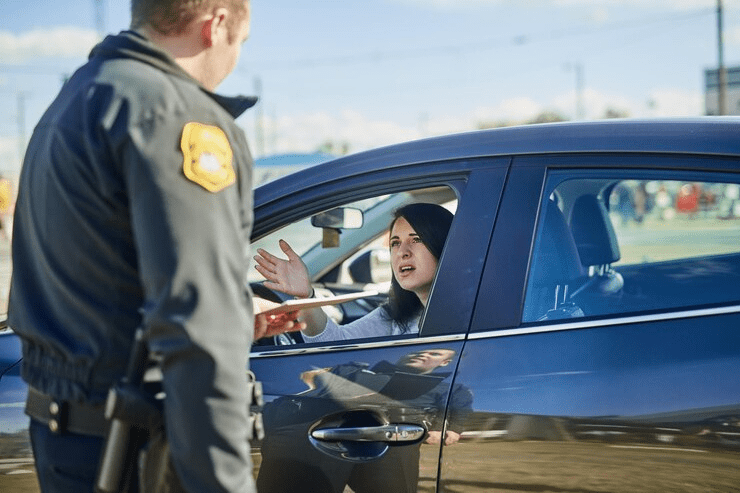 Woman upset and traffic officer with ticket for checkpoint security and crime investigation on highway Police law